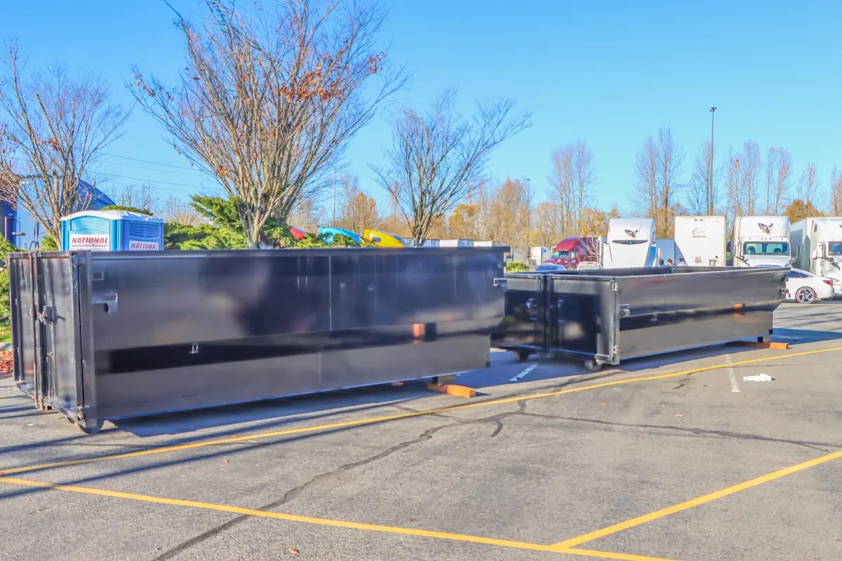 Professional dumpster rental service with roll-off container on residential driveway in Chaska